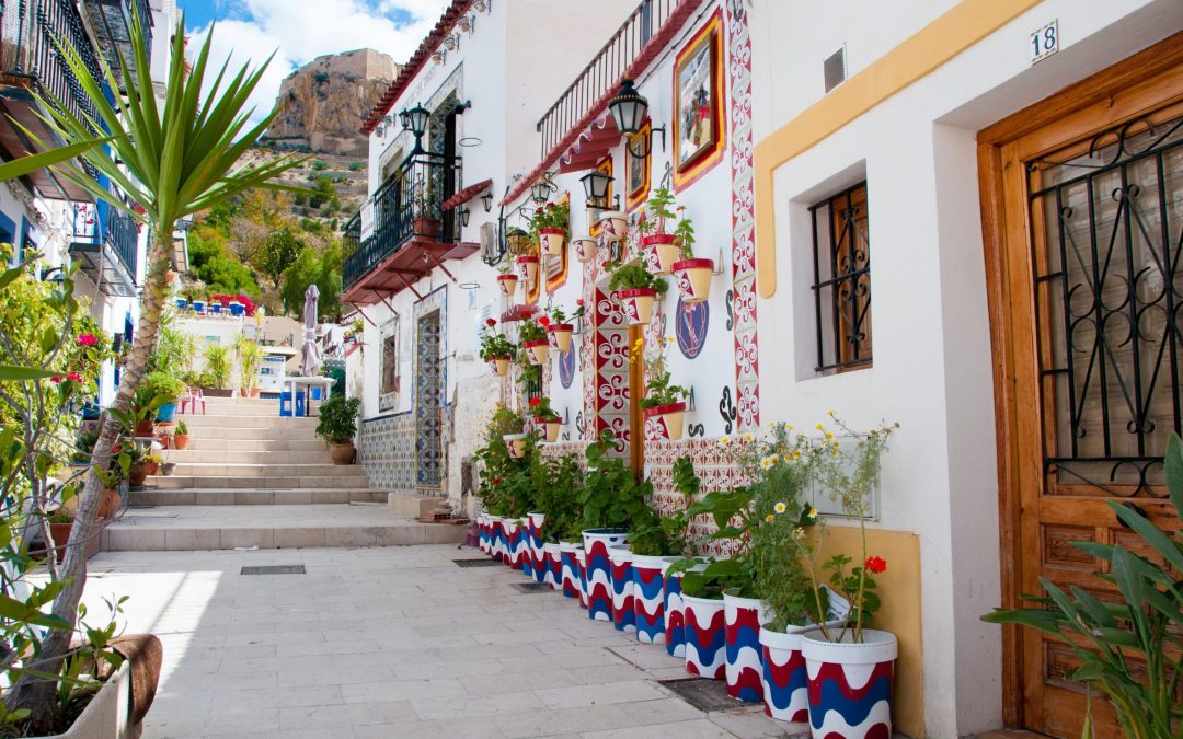 A street of white, Spanish-style houses.