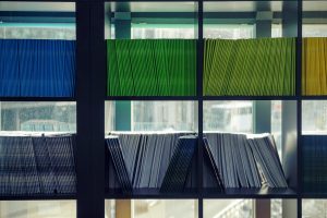 A bookshelf of documents.